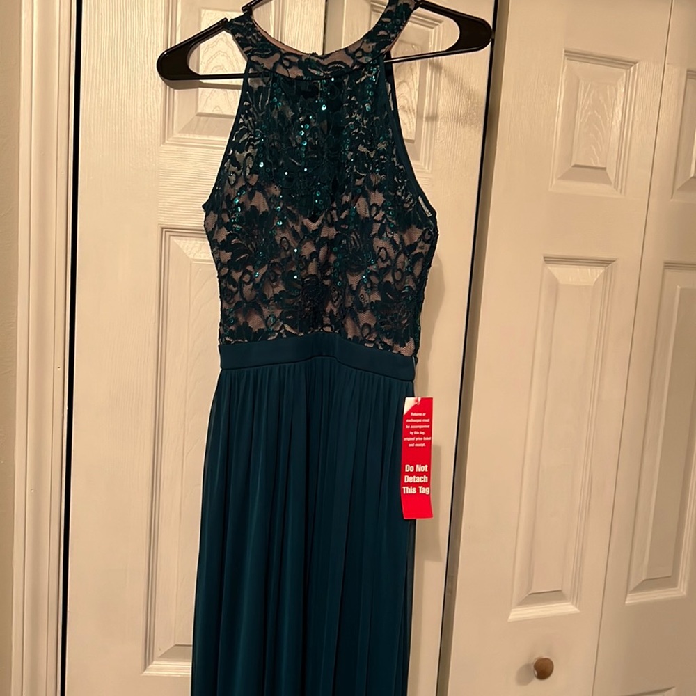 Long emerald green dress. Underlay goes half way down.